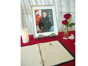 Condolence books are set up in the lobby of Edmonton Police Service southwest division station to give people a chance to pay their respects to Const. Daniel Woodall. Messages of condolence will be presented to Woodall’s family in Edmonton.