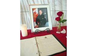 Condolence books are set up in the lobby of Edmonton Police Service southwest division station to give people a chance to pay their respects to Const. Daniel Woodall. Messages of condolence will be presented to Woodall’s family in Edmonton.