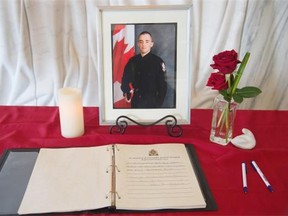 Condolence books were set up in the lobby of EPS Southwest Division Station to provide individuals with an opportunity to pay their respects to Const. Woodall. People are invited to leave messages of condolence, which will then be presented to Const. Woodall’s family in Edmonton. June 10, 2015.