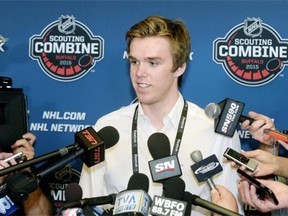 Connor McDavid answers a question about playing in the National Hockey League during a news conference at the NHL Scouting Combine on Friday at Buffalo, N.Y.