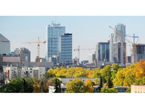 Construction cranes crowd the city skyline in Edmonton on Monday Sept. 22, 2014. Alberta’s unemployment rate edged up slightly to 5.8 per cent in May. Edmonton Journal/FILE