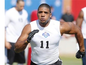 Defensive end Michael Sam runs through a drill during the NFL super regional combine football workout at Tempe, Ariz., on March 22, 2015.