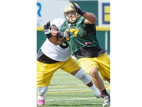 Defensive tackle Eddie Steele tries to get past an offensive lineman during a drill at the Edmonton Eskimos’ training camp on Wednesday at Fuhr Sports Park in Spruce Grove.
