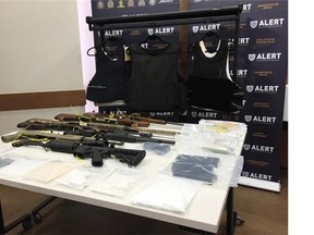 Drugs and guns from a June 5 bust in Bonnyville displayed on a table at ALERT’s Edmonton building.