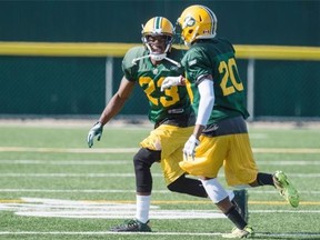 Edmonton Eskimos defensive backs Marcell Young (23) and Raye Hartmann (20) work in one-in-one drills during Sunday’s first day of training camp practices at Spruce Grove.