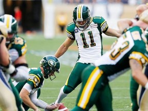 Edmonton Eskimos’ Grant Shaw kicks a field goal against the Winnipeg Blue Bombers in a Canadian Football League game at Winnipeg on July 17, 2014.