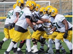 The Edmonton Eskimos offensive linemen practise during the Canadian Football League team’s training camp at Fuhr Sports Park in Spruce Grove on June 4, 2015.