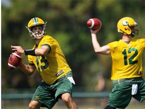 Edmonton Eskimos quarterbacks Mike Reilly, left, and Justin Goltz throw passes during drills in the Canadian Football League team’s mini-camp at Historic Dodgertown in Vero Beach, Fla., on April 19, 2015.