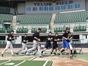 The Edmonton Prospects begin Monday’s practice at Telus Field with a jog around the field.