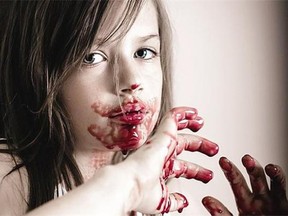 Edyn Hlady, 8, poses with fake blood in this photograph taken by DxE Photography. The photographs appear creepier than the experience felt, her mother says.
