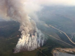 Firefighters are battling a 500-hectare fire burning 25 kilometres east of Slave Lake.