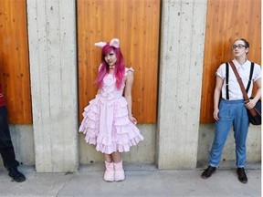 From left, Justus Neufeld, Annie Cai and Zander Hartman pose in their Queer Prom outfits.