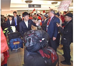 A group of fans welcome China’s women’s soccer team at the Edmonton International Airport on Friday.