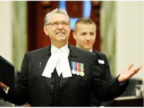 House speaker Gene Zwozdesky bids farewell following the swearing-in ceremony in the house of the Alberta Legislature June 1, 2015.