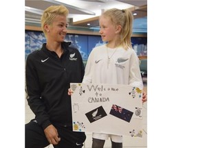 Kaelyn Cooper meets New Zealand women’s soccer team captain Abby Erceg at Edmonton International Airport on June 2, 2015.