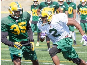 Keith Reynolds (35) and Etauj Allen (2) at Edmonton Eskimos training camp at the Fuhr Sports Park in Spruce Grove on Saturday, June 6, 2015. Allen got a crash course in team history when he learned he’ll be wearing the jersey number formerly worn by Fred Stamps and Henry (Gizmo) Williams.