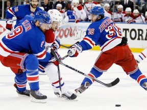 Kevin Klein defends against Daniel Briere.