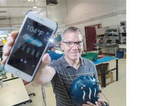 Levven Electronics has developed technology for Arctic Spas that lets homeowners control their spa’s water chemistry with a phone. Owner James Keirstead with the Pool Boy phone app and the Pool Boy controller.