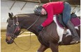 Locke Boros, 65, gives his horse a hug at the end of the lesson at Whitemud Equine Learning Centre.