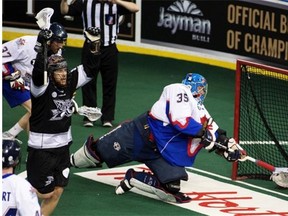 Ben McIntosh celebrates an Edmonton Rush goal scored by Robert Church (not pictured) during the second game of the National Lacrosse League final at Rexall Place on June 5, 2015.