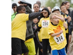 Owen Severinski, #314, and about 120 other kids warmed with Zumba before running a 5K course in Rundle Park.
