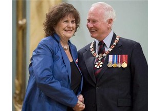 Governor General David Johnston invests Lois Mitchell, from Calgary, Alta. as a Member of the Order of Canada during a ceremony at Rideau Hall in Ottawa, on Friday May 3, 2013. Lois Mitchell has been appointed as the new Alberta lieutenant-governor.