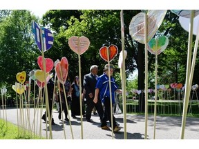 People take part in the planting of a heart garden during the closing ceremony of the Truth and Reconciliation Commission, at Rideau Hall in Ottawa on Wednesday, June 3, 2015. A heart garden will pop up in Edmonton this summer.