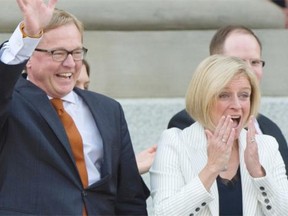 Premier Rachel Notley and her 11 cabinet ministers are sworn in on the legislature steps in Edmonton on May 24, 2015.