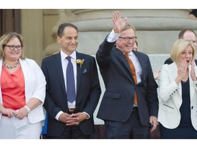 Premier Rachel Notley and her 11 NDP cabinet ministers are sworn in on the Legislature steps in Edmonton on Sunday, May 24, 2015. (Edmonton Journal/File)