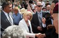 Premier Rachel Notley greets the crowd after she and 11 cabinet ministers are sworn in on the legislature steps in Edmonton on May 24, 2015.