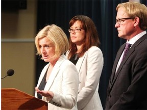 Premier Rachel Notley, left, was joined by Minister of Justice and Aboriginal Affairs Kathleen Ganley and Education Minister David Eggen as she made announcements regarding funding for school boards and the stoppage of the closure of the Calgary Young Offenders Centre on May 28, 2015.