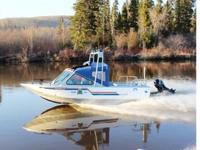 An RCMP jet boat capsized Friday on the Athabasca River, throwing four officers into the water.