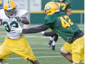 Rookie running back Shakir Bell tries to get past linebacker Scott Williams during the Edmonton Eskimos’ training camp session on Wednesday at Fuhr Sports Park in Spruce Grove.