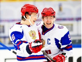 Russia’s Anton Slepyshev, right, is congratulated by teammate Nikita Zadorov after scoring a goal in a world junior hockey championship quarter-final playoff game against the United States at Malmo, Sweden, on Jan. 2, 2014.