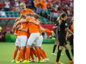 Stefanie van der Gragt jumps into the celebration after the Netherlands scored its only goal against New Zealand in a Women’s World Cup game at Commonwealth Stadium on June 6, 2015.