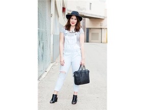 Stylish local Baillie Scheetz pairs her lightwash overalls with a striped top and statement hat for an easy, spring-ready look.