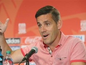 Team Canada coach John Herdman speaks to the media during a news conference at Commonwealth Stadium on Wednesday.