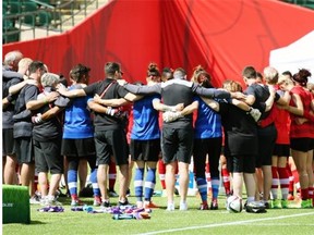 Team Canada has a group huddle before its final practice before the Women’s World Cup soccer tournament starts Saturday at Commonwealth Stadium.