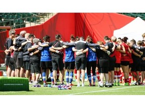 Team Canada has a group huddle before Friday’s practice for the Women’s World Cup soccer tournament, which starts Saturday at Commonwealth Stadium.