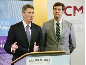 Vancouver Mayor Gregor Robertson (left) and Edmonton Mayor Don Iveson (right) speak with the media at the Federation of Canadian Municipalities Annual Conference and Trade Show at the Shaw Conference Centre in Edmonton on June 4, 2015.