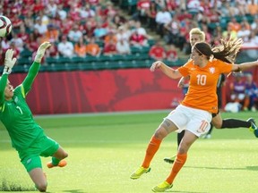 New Zealand goalkeeper Erin Nayler makes a save on Danille van de Donk of the Netherlands in a Women’s World Cup soccer game at Commonwealth Stadium on