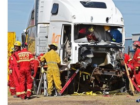 About 80 firefighters from across Canada participated in the 2015 Big Rig HOT (hands-on training) learning symposium at the Nisku Fire District Station on June 25, 2015. Now in its sixth year, firefighters are exposed to live scenarios focusing on various big rig rescue situations.