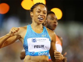 Allyson Felix of the United States celebrates after winning the women’s 200-metre race at the IAAF Diamond League event in Doha, Qatart, on May 15, 2015.