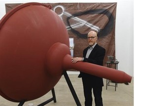 Artist Royden Mills with the parabolic dome of his sculpture Resonant Point, which will be installed near the new bridge in Terwillegar Park, during a press conference at the DC3 Gallery in Edmonton on Thursday June 18, 2015.