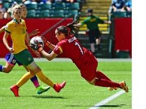 Australia goalkeeper Lydia Williams makes a save against Japan during the quarter-final match of the 2015 FIFA Women’s World Cup at Commonwealth Stadium in Edmonton.