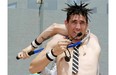 Australian contortionist Al Millar, also known as Alakazam, squeezes his five-foot-11 frame through a squash racquet.