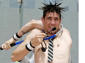 Australian contortionist Al Millar, also known as Alakazam, squeezes his five-foot-11 frame through a squash racquet.
