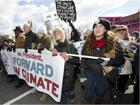 Bill McKibben, centre, joins a march from the National Mall to the White House in Washington during a 2013 rally on calling on President Barack Obama to reject the Keystone XL oil pipeline from Canada.