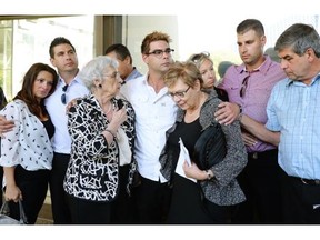Brian Ilesic’s family outside the Edmonton Law Courts on Sept. 11, 2013 after the sentencing of Travis Baumgartner, who received a sentence of 40 years for the murder of three armoured car security guards at the University of Alberta.