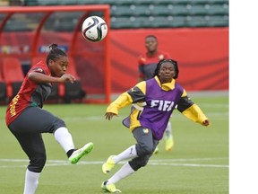 Cameroonian players get ready for their match against China in a training session at Commonwealth Stadium Friday.